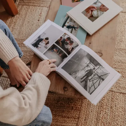 Open photo book resting on a knitted blanket